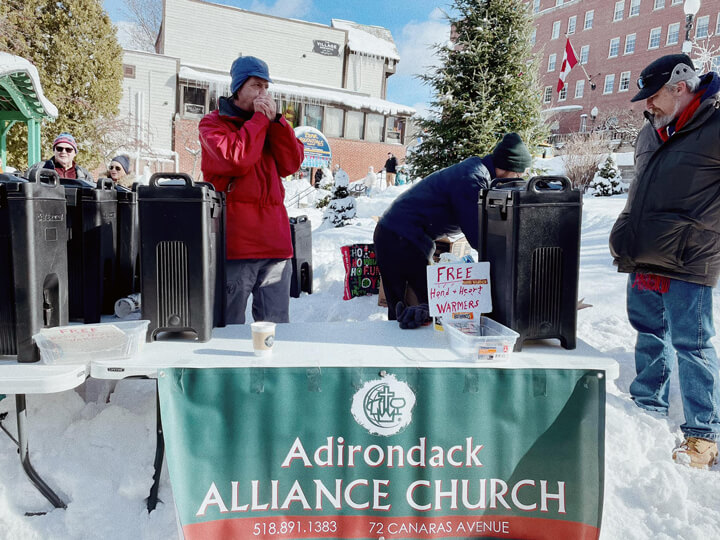 Adirondack Alliance Church serving the community at a winter outdoor event in Saranac Lake