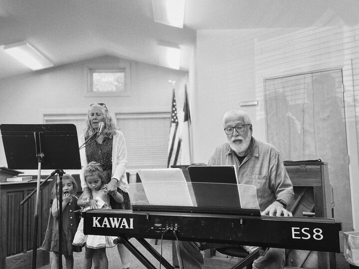 Worship leaders leading music during Sunday morning service at Adirondack Alliance Church